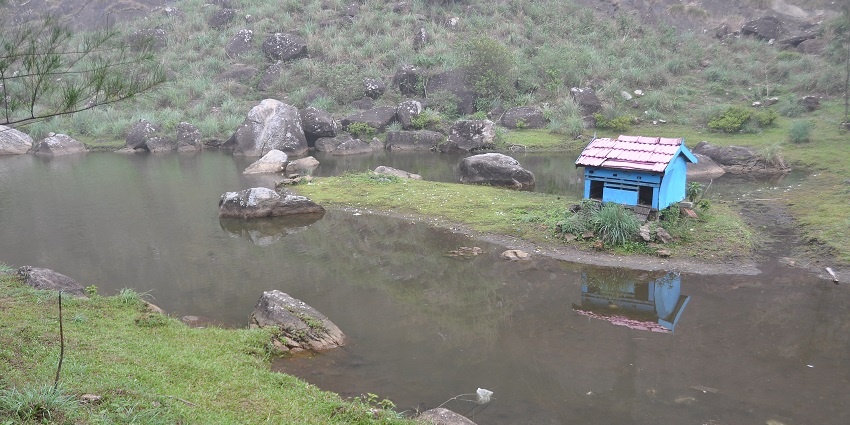 Views of a beautiful vacation lake passing through the meadows and greenery