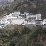 A view of Bhawan at the sacred Vaishno Devi Temple surrounded by mountains and trees