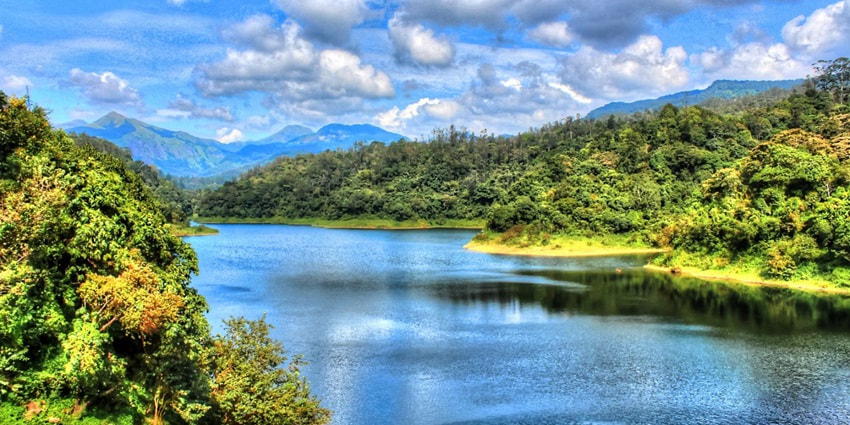 A scenic view of Valparai Lake that offers a great backdrop for photography.