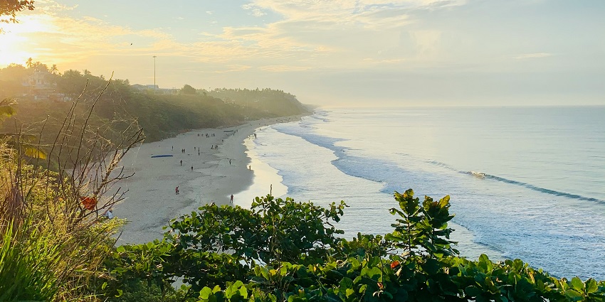 An aerial view of a beach in Varkala, one of the serene places to visit in South Kerala.