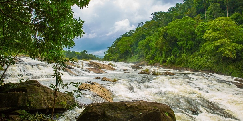 Picturesque view of sparkling waters of Vazhachal falls flowing on the Chalakudy river