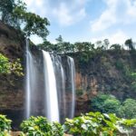 Breathtaking view of Vellappara Waterfalls in Kerala, cascading down lush green cliffs.