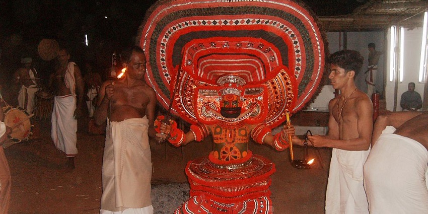 A view of the priests praying at the famous Vettakkorumakan Temple located near Malappuram