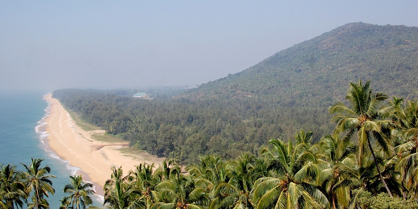 Trekking through lush Ezhimala Hill is one of the best things to do in Thalassery, Kerala.