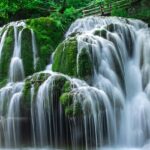 Water Flowing into River in a lush green forest - explore the Vilangad Waterfalls