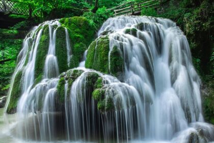 Water Flowing into River in a lush green forest - explore the Vilangad Waterfalls