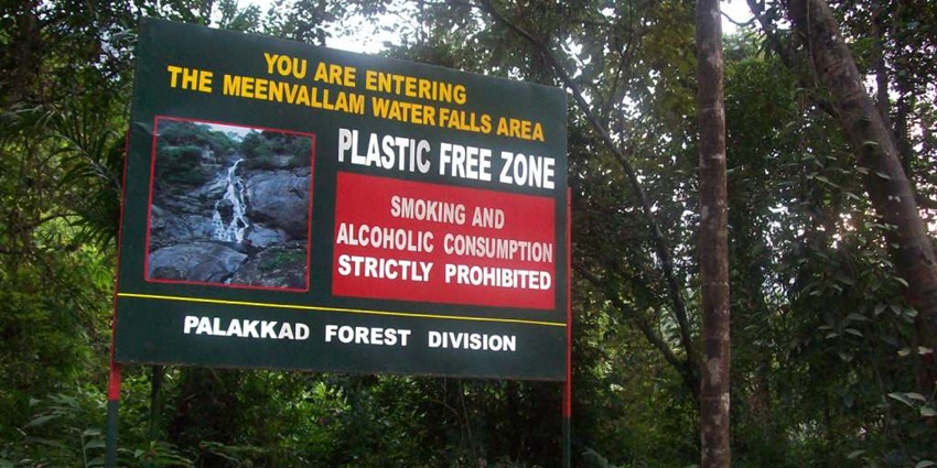 A big sign board serving as the entry point of Meenvallam Waterfall