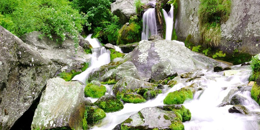 Waterfall cascading down rocky cliffs - one of the best things to do in Manali in January