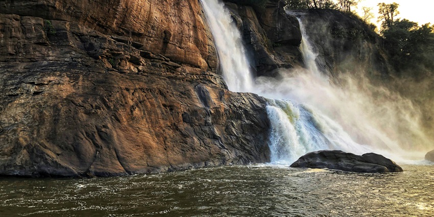 A breathtaking view of a waterfall in Kerala, which is a must-visit for all travellers.