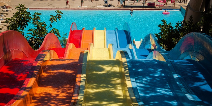 Colourful water slide twisting through a vibrant water park - Wayanad adventure Parks