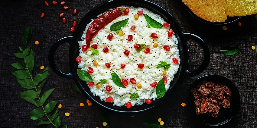 A view of a bowl with rice and vegetables, which you can enjoy around Ambanad Waterfalls.