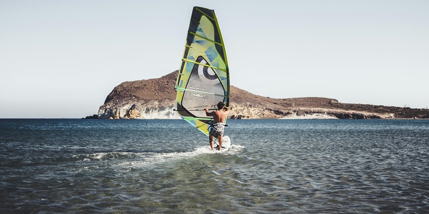 Windsurfing in Varkala, riding waves with vibrant coastal scenery - water sports in Kerala