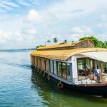 Enjoy a pleasant stay onboard one of the wooden houseboats at Alleppey in Kerala