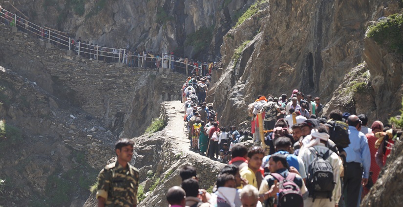 View of devotees trekking the rugged paths during the sacred Yatra of Amarnath Baba.