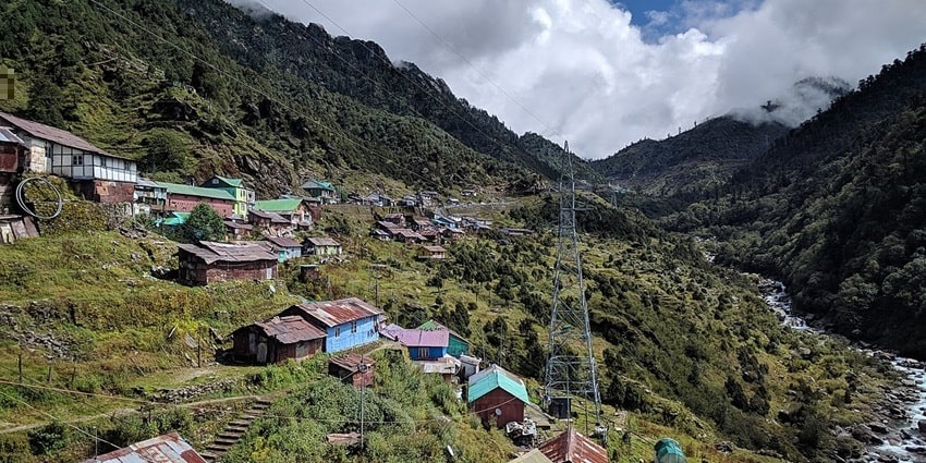 Yuksom valley surrounded by snow-capped mountain ranges - places to visit near Darjeeling