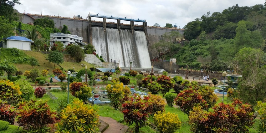 Peechi Dam with a serene reservoir, surrounded by lush greenery and scenic views.