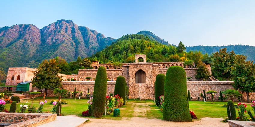 A majestic view of the mediaeval Akhnoor Fort in Jammu with a scenic lake and gardens