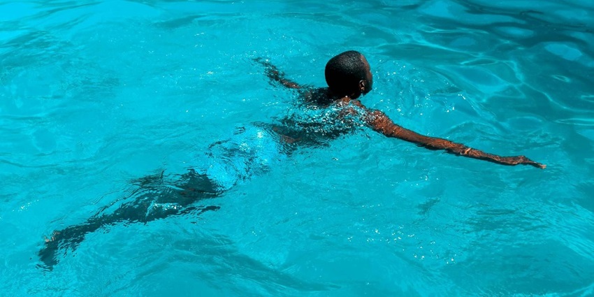 Swimming and Bathing
Alt Text: Enchanting Views of a Waterfall descending in the lake near the hill of Nilambur