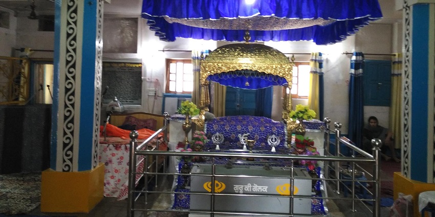 The serene prayer hall of a Gurudwara Mata Sahib Kaur Ji in Abu Dhabi, UAE.