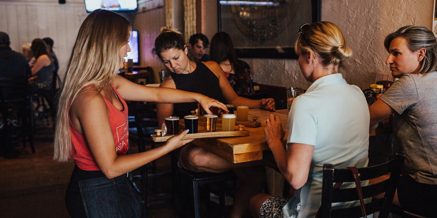 People enjoying drinks at a bar
