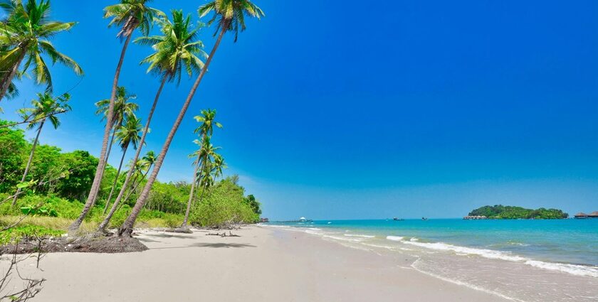 A mesmersing view of a tropical beach under the blue sky, a must visit spot in Thailand.