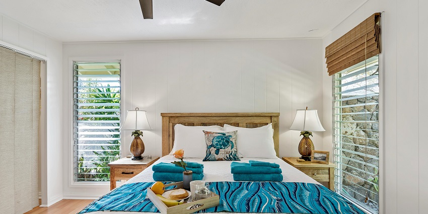 Hotel bedroom with a plush bed, modern decor, and warm, ambient lighting.