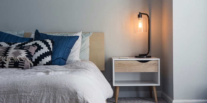 Hotel bedroom featuring stylish furniture, a comfortable bed, and a well-decorated space.