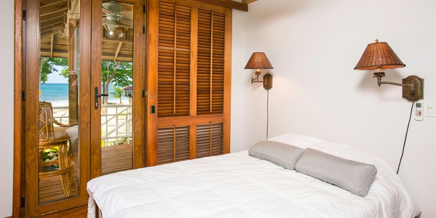 A stylish hotel room showcasing a cosy bed, elegant decor, and essential amenities.