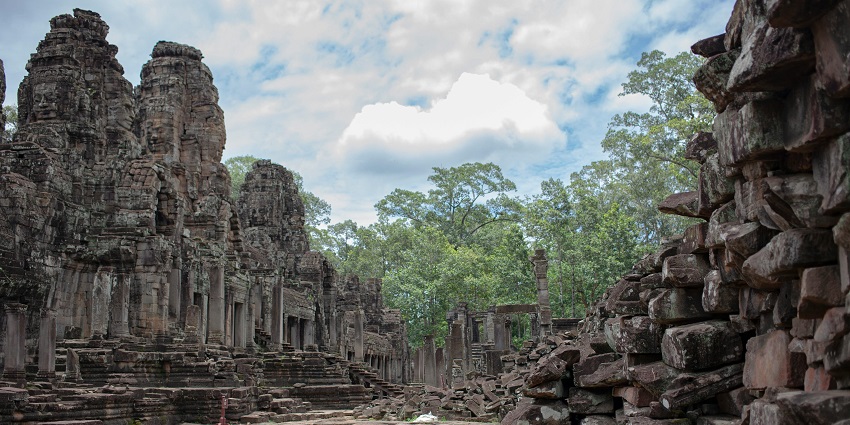 Explore the unique architecture and stunning walls of Bayon Temple in Cambodia.