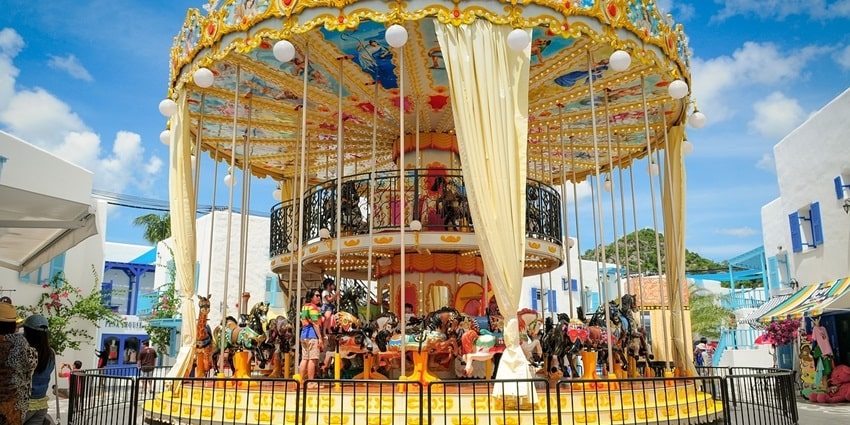 Snapshot View of an adventure park and the surrounding carousel rides