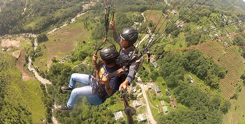 A person enjoying paragliding in Sikkim