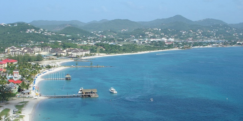 Scenic view from the top of Pigeon Island, showcasing lush greenery and the ocean.