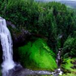 Landscape of waterfalls in Nagaland cascading rocky cliffs, surrounded by lush forests.