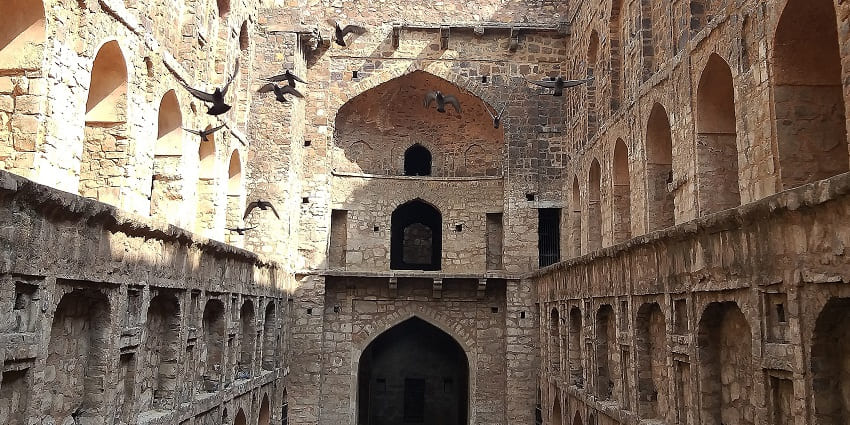 Agrasen ki Baoli is a historic stepwell featuring ancient architecture and structure.