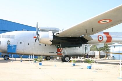 A mesmerising view of an aeroplane with red circles on its wings during the daytime.