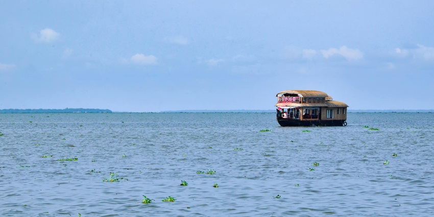 A boat wades through the Alappuzha backwaters, a unique experience to have near international coir museum