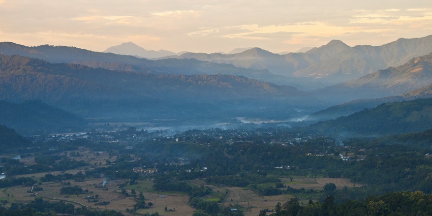 Beautiful panoramic image of the Along village surrounded by the ranges of Himalayas