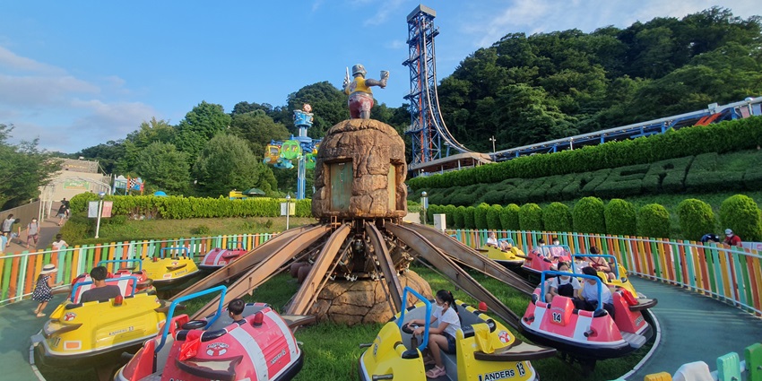 Children enjoying a ride at an amusement park