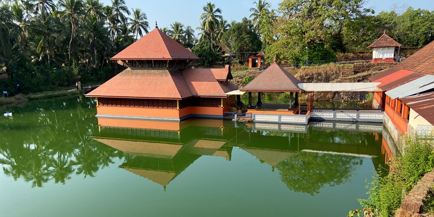A captivating view of the Ananthapura Lake Temple housed over a tranquil lake in Kerala