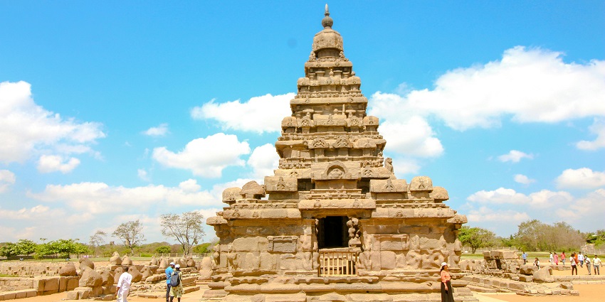 Panoramic view of an ancient temple of South India surrounded by hills and dry forest
