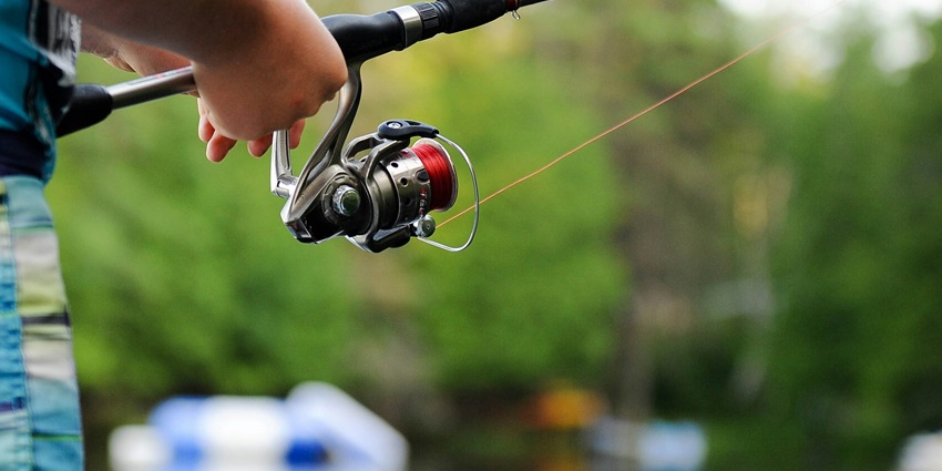 A glimpse of a person trying angling, one of the exciting things to do in Manali in June.
