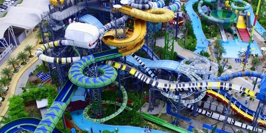 Aquaverse Water Park with themed water attractions, thrilling slides, and family fun areas.