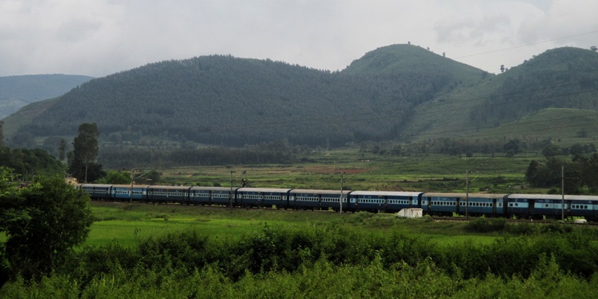 Scenic view of Araku Valley, a hill station with lush greenery and misty mountains.