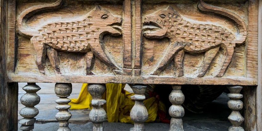 Kamru Fort has intricate artwork on the wooden walls of the same, showcasing rich structure.