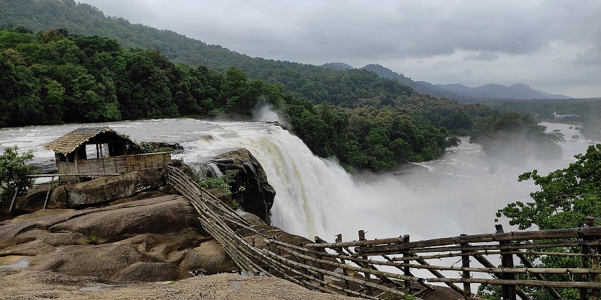 Athirappilly Waterfalls in Kerala cascading powerfully through rocks and dense greenery