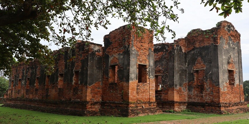 The ruins of an ancient temple, Wat Phra Si Sanphet, in the middle of a field in Ayutthaya