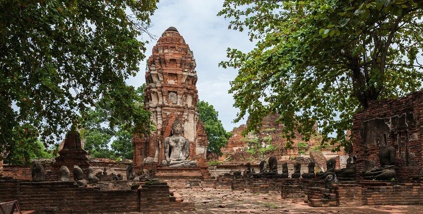 Beautiful snapshot of a Buddhist Temple surrounded by the scenic lush trees in Thailand