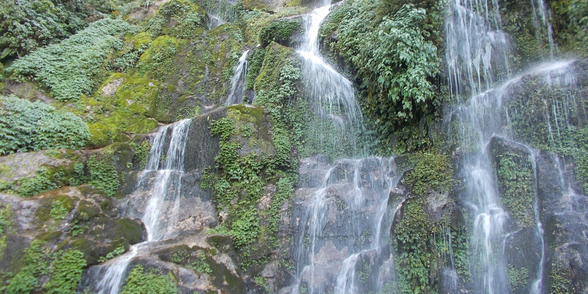 Silver water cascading down rocks, such views make this waterfall an ideal sight for a nature retreat