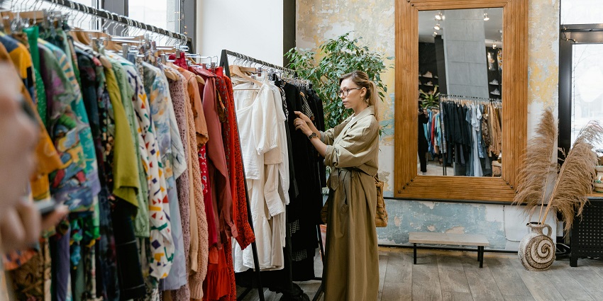 A woman selecting clothes to buy at a luxury shopping place in Bali