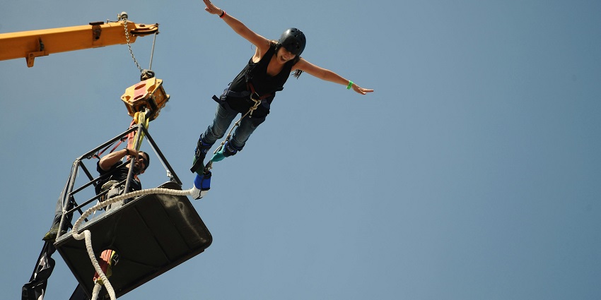 The image of a man taking a leap from the spot of bungee jumping in Bali, Indonesia